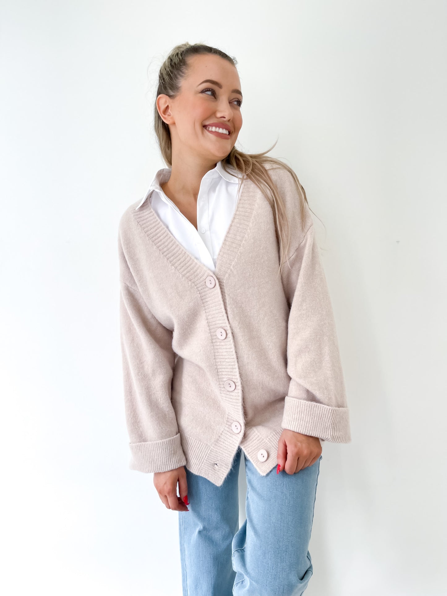 Stone Coloured Winter Cardigan with a generous oversize fit and wide cuffs by Fria the Label.